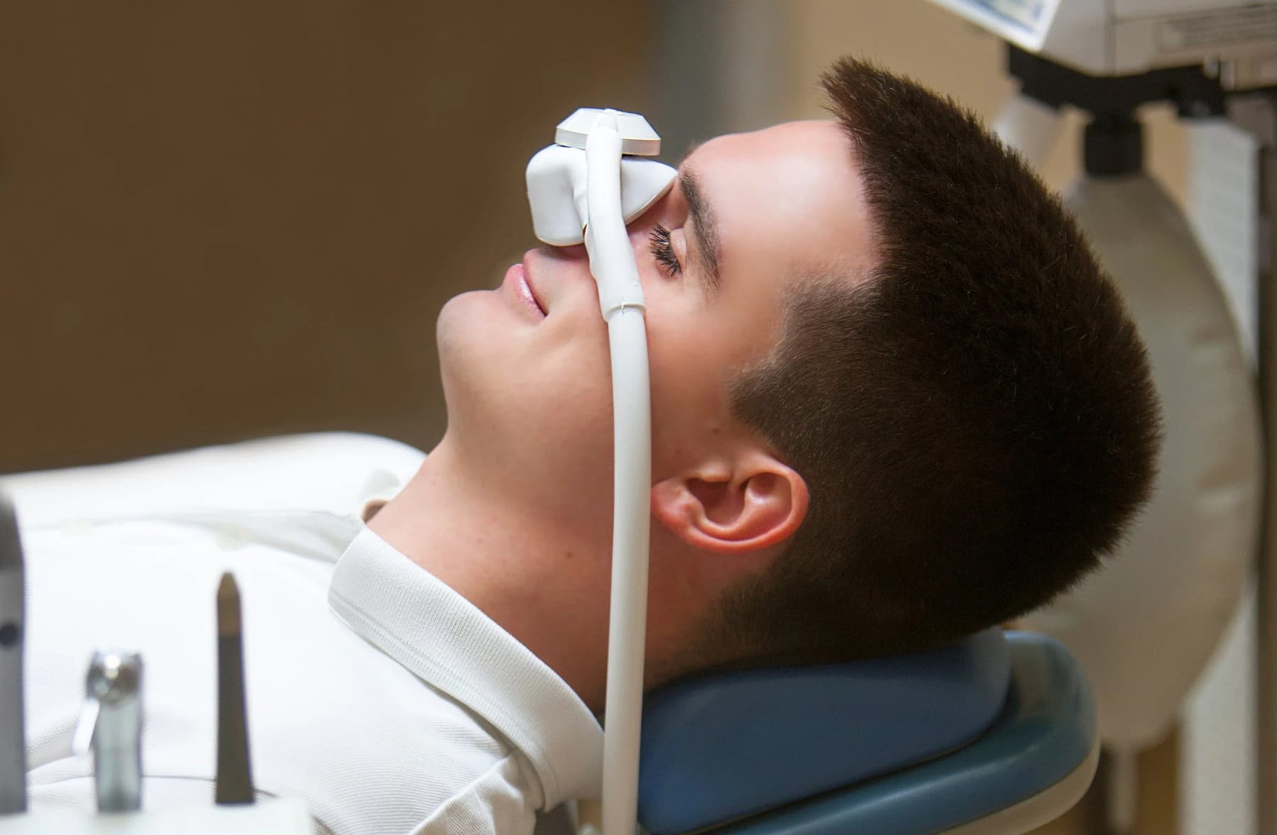 Patient relaxing with nitrous oxide sedation during treatment at Rancho Bernardo Dental Arts